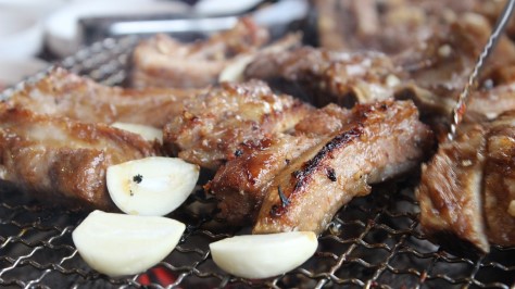 Korean bbq with garlic on grill