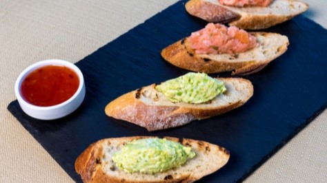 Smoke salmon tapas on slices of bread